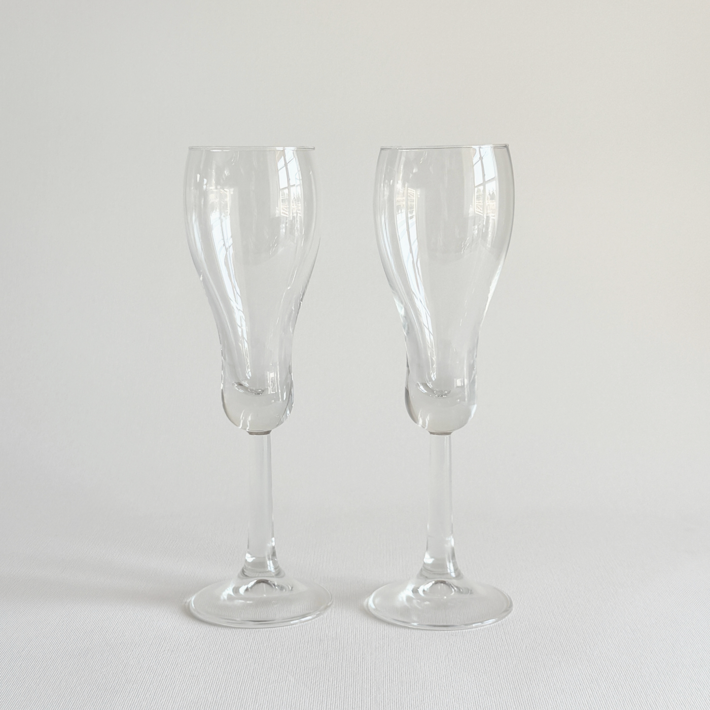 Italian champagne tulip flutes — set of 2, front view showing tulip bowl and rounded base, 1970s Italian production