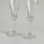 Italian champagne tulip flutes — base view showing rounded foot and overall condition, minor surface marks