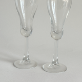 Italian champagne tulip flutes — base view showing rounded foot and overall condition, minor surface marks