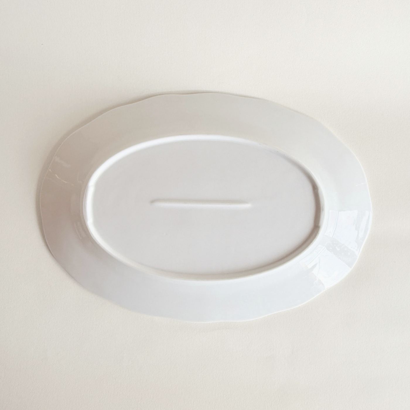 White oval serving dish in porcelain — angled view showing form and depth, 900 g, As New condition