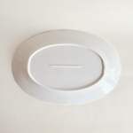 White oval serving dish in porcelain — angled view showing form and depth, 900 g, As New condition