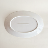 White oval serving dish in porcelain — angled view showing form and depth, 900 g, As New condition