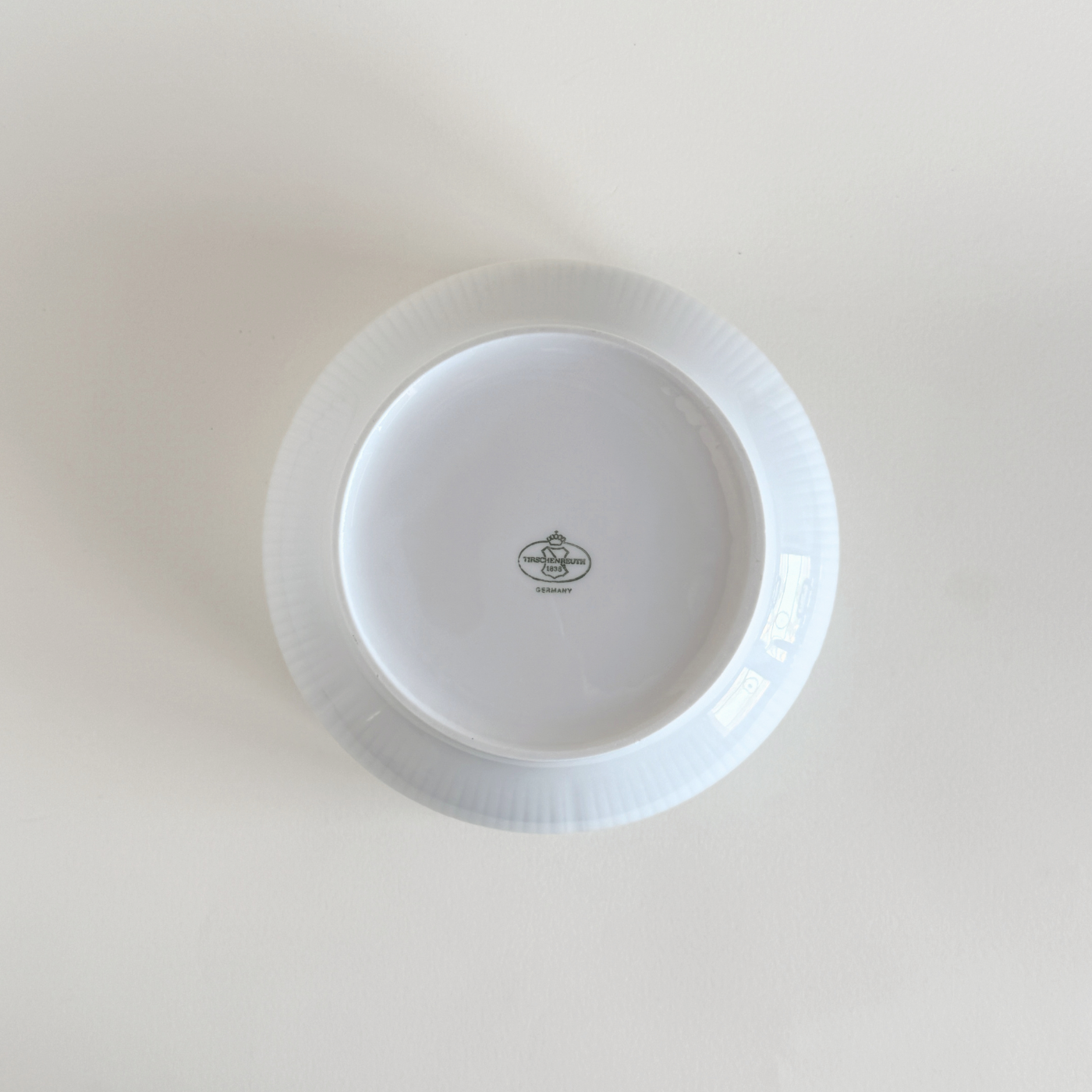 White ceramic bowl with scalloped edge 