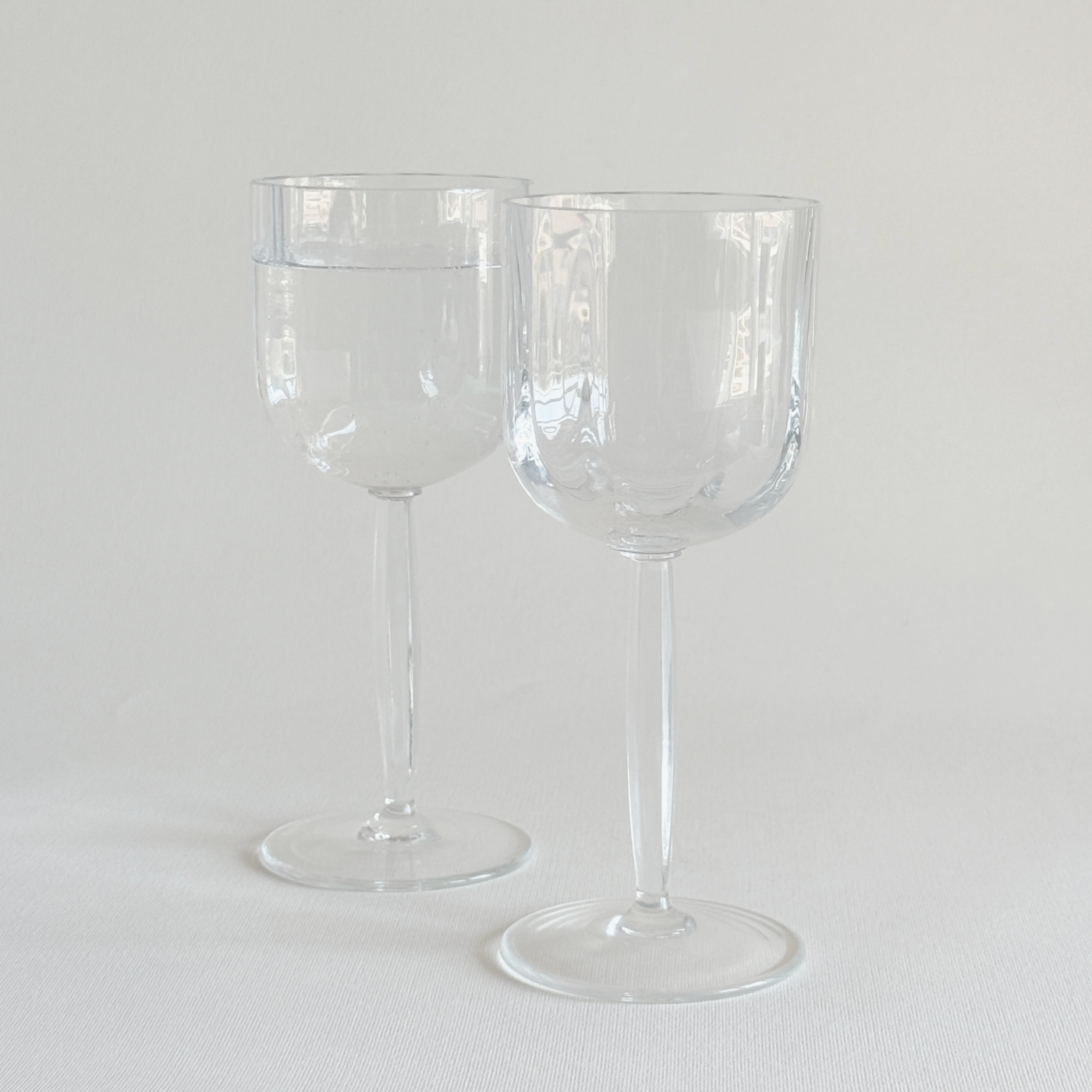 Italian ribbed white wine glasses — base view showing foot and overall condition, minor surface marks