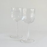 Italian ribbed white wine glasses — base view showing foot and overall condition, minor surface marks